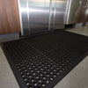 Industrial black anti-fatigue kitchen mat with textured surface