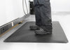 Industrial chemical-resistant anti-fatigue mat with textured grip surface.