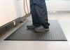Grey and black ribbed anti-fatigue mat for industrial comfort