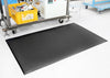 Industrial anti-fatigue mat with textured surface for grip and durability