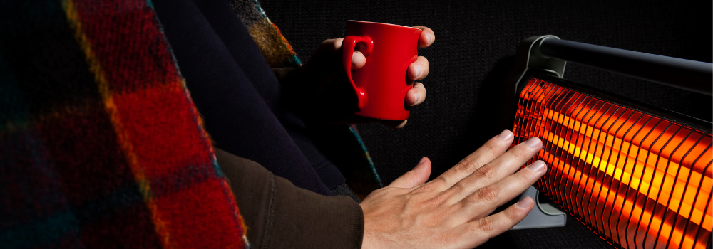 Warming hands in front of radiator
