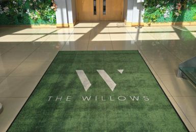 Green willows branded logo mat by entrance