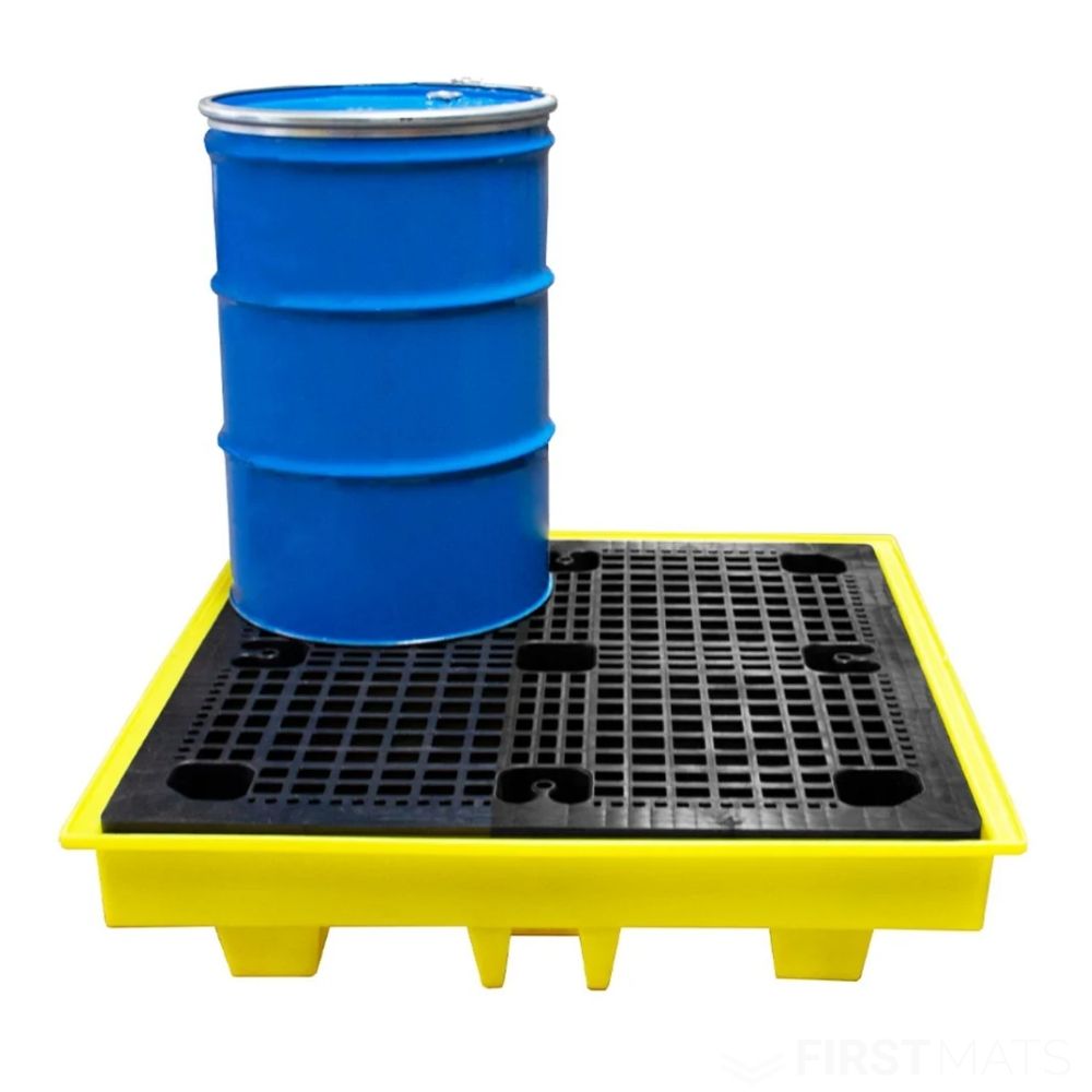 Blue drum on a yellow and black plastic spill pallet against a white background