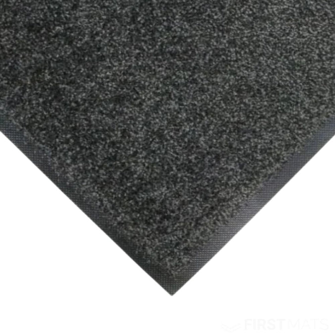 Close-up of a textured black mat on a white background