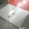 White tacky mat in entrance with dusty footprints