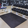 Rubber weight lifting mat in a commercial gym