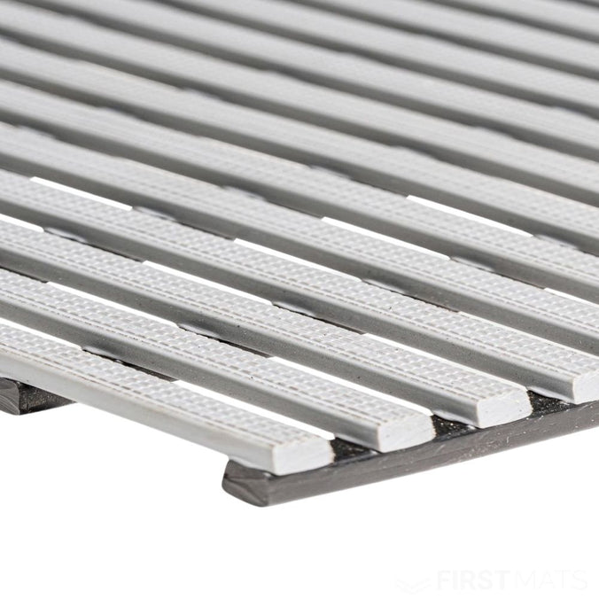 Grey duckboard matting corner closeup