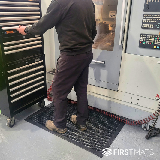 Rubber workstation mat by a CNC machine