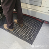 Standing on a rubber non-slip anti fatigue mat