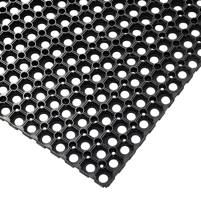 Outdoor rubber mat corner swatch showing details of hole pattern