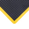 Black bubble textured mat with yellow border on a white background