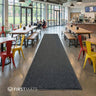 A long made to measure mat in a canteen