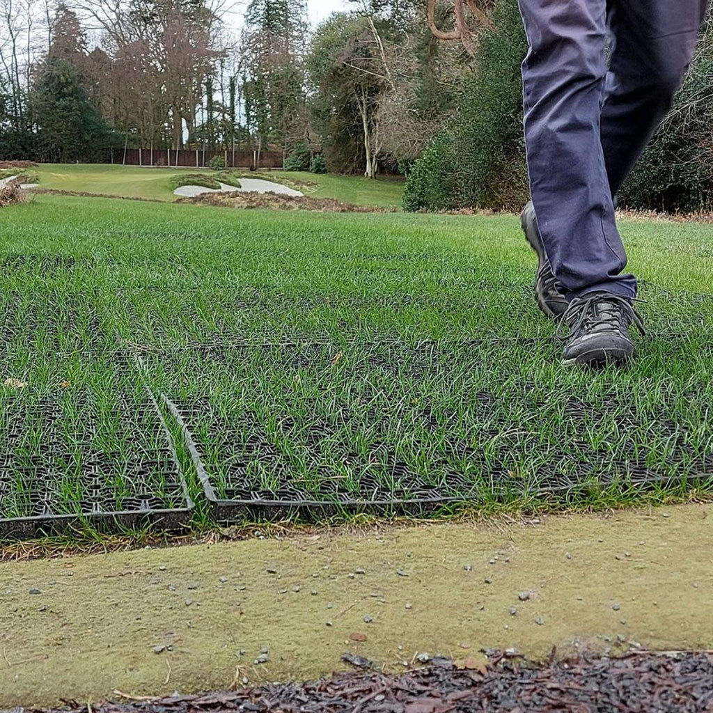 Rubber Ground stabilisation mats with grass growing through
