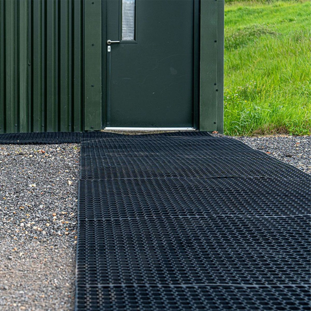 Ground stabiliser mats outdoors by doorway