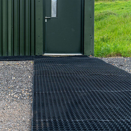 Ground stabiliser mats outdoors by doorway