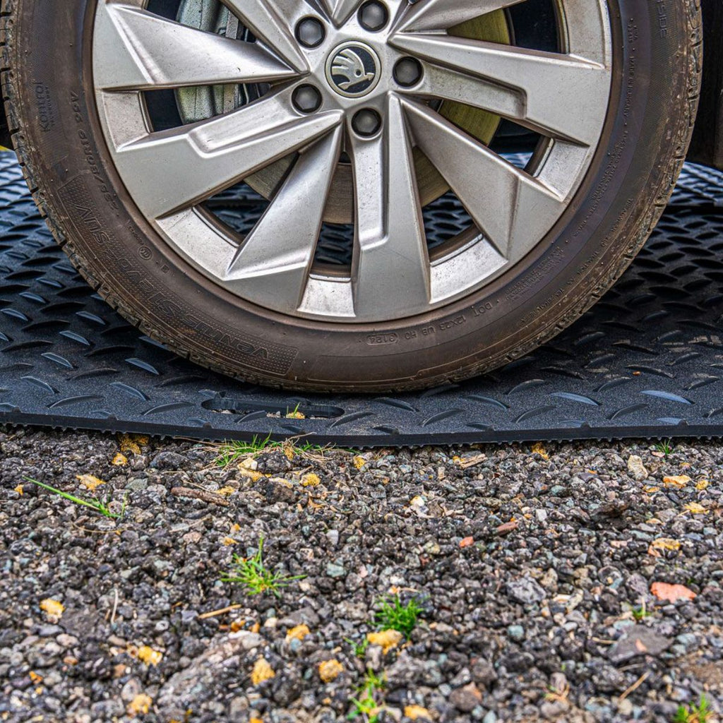 Car parked on heavy duty ground protect tile