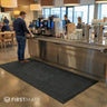 Floor mat in a canteen drink service area