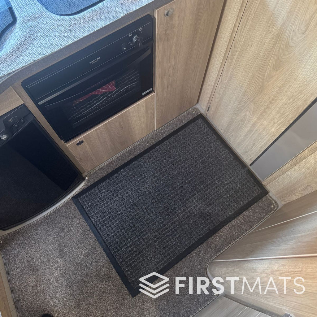 Grey mat on a motorhome floor by the cooker