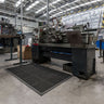 Extra-large industrial anti-fatigue mat roll with swarf collection