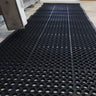 Industrial-grade, extra-large anti-fatigue mat roll with swarf-catching feature