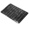 Black rectangular mat with white speckled pattern on a white background