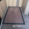 Textured brown floor mat inside a motorhome