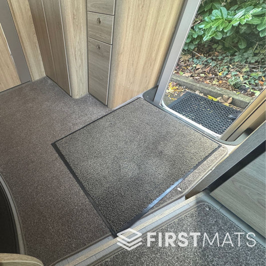 Beige mat on a carpeted motorhome floor