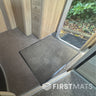 Beige mat on a carpeted motorhome floor