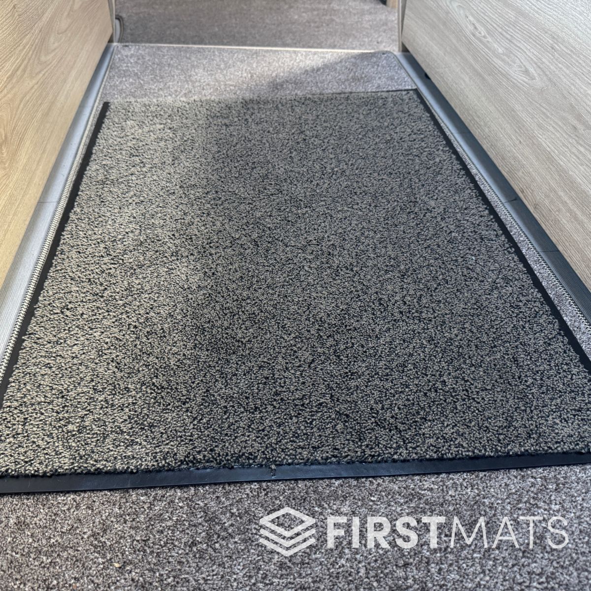 Beige mat in a motorhome between the seats