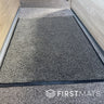 Beige mat in a motorhome between the seats