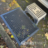 Black rubber floor mat with honeycomb pattern outside a motorhome