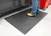 Black anti-fatigue PinnacleMat with oil and fire resistance in industrial environment.