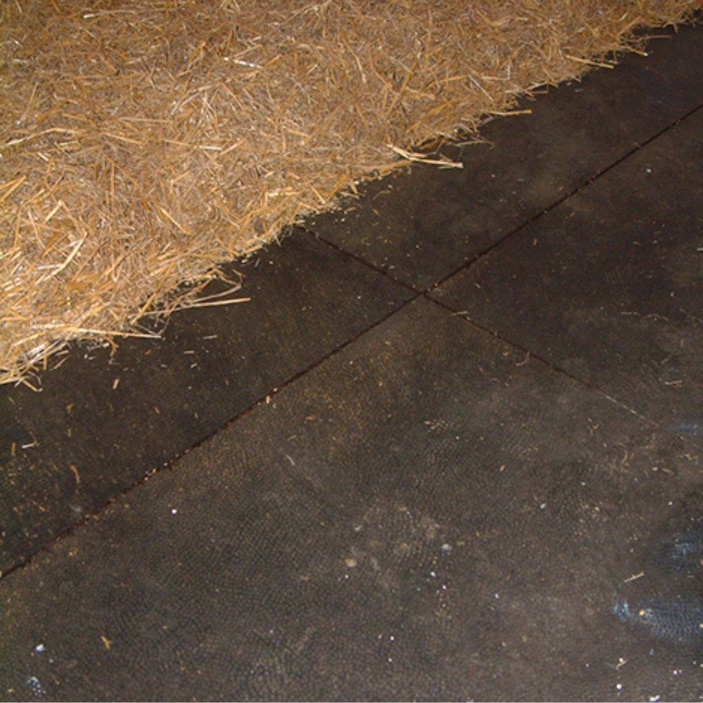 Rubber stable mats with hay bedding