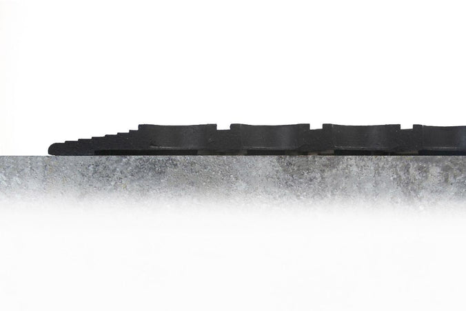Anti-fatigue industrial mat roll with debris collection