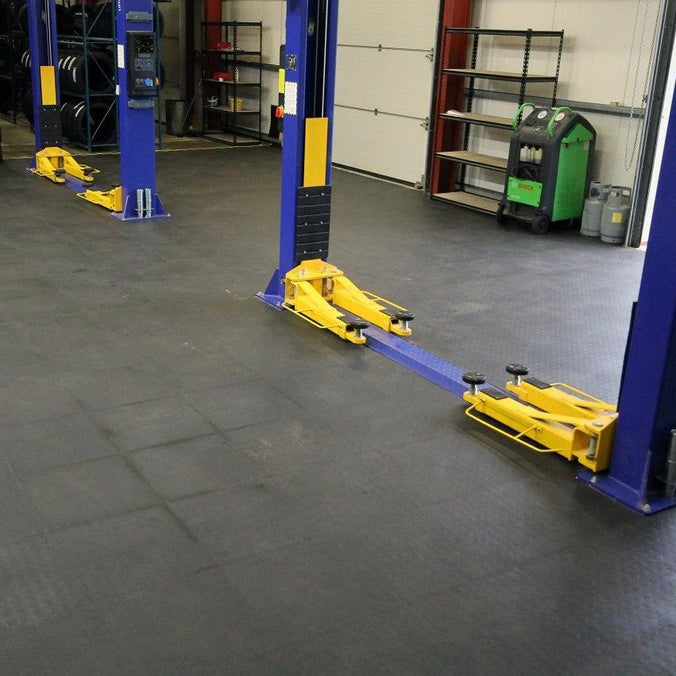 Auto workshop with PVC tiles on floor