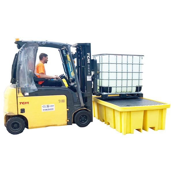 Forklift loading IBC onto bund pallet