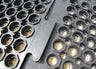 Black interlocking anti-fatigue industrial mats for comfort and reduced leg strain.
