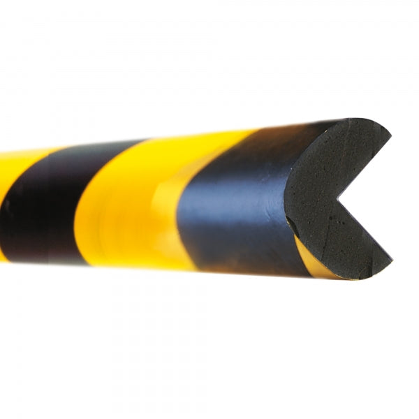 A close-up view of a self-adhesive foam edge protector with black and yellow hazard bands.
